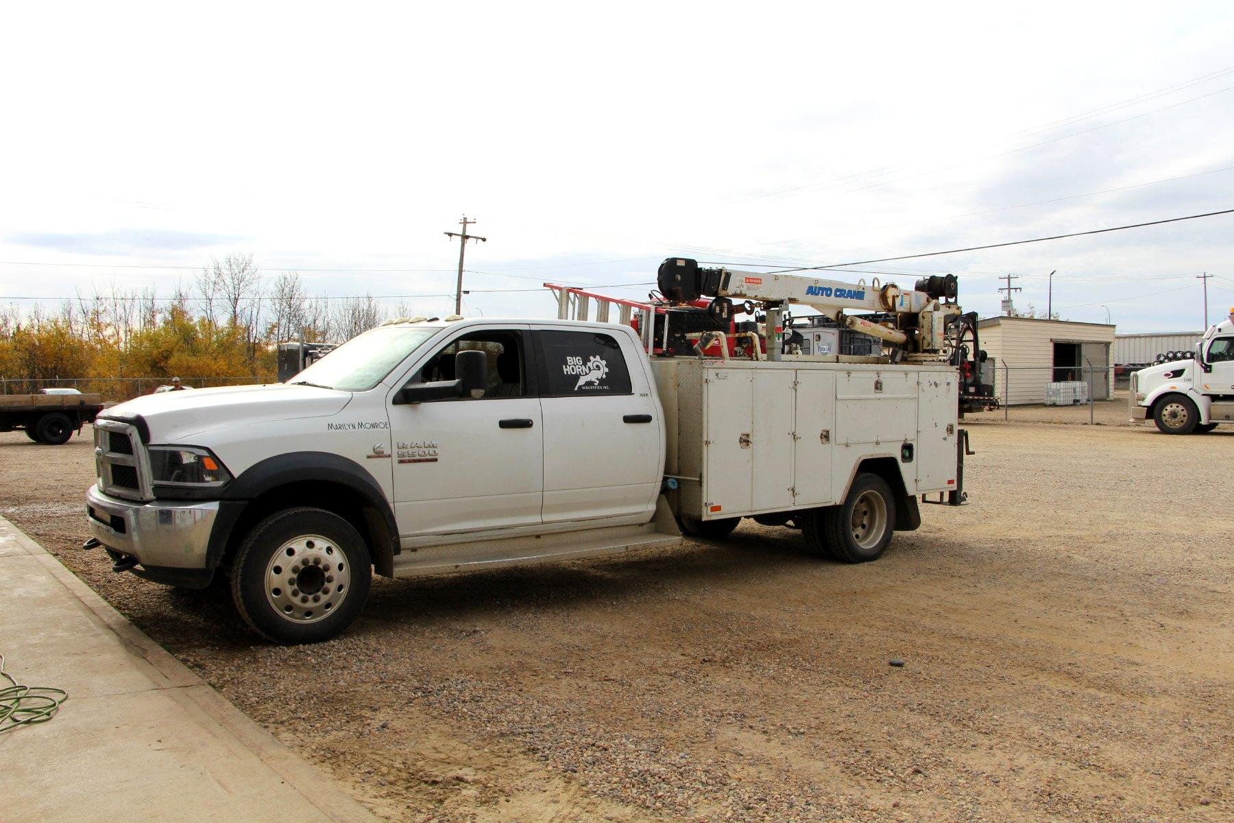 Side view of the Big Horn service truck, with its service body and crane.