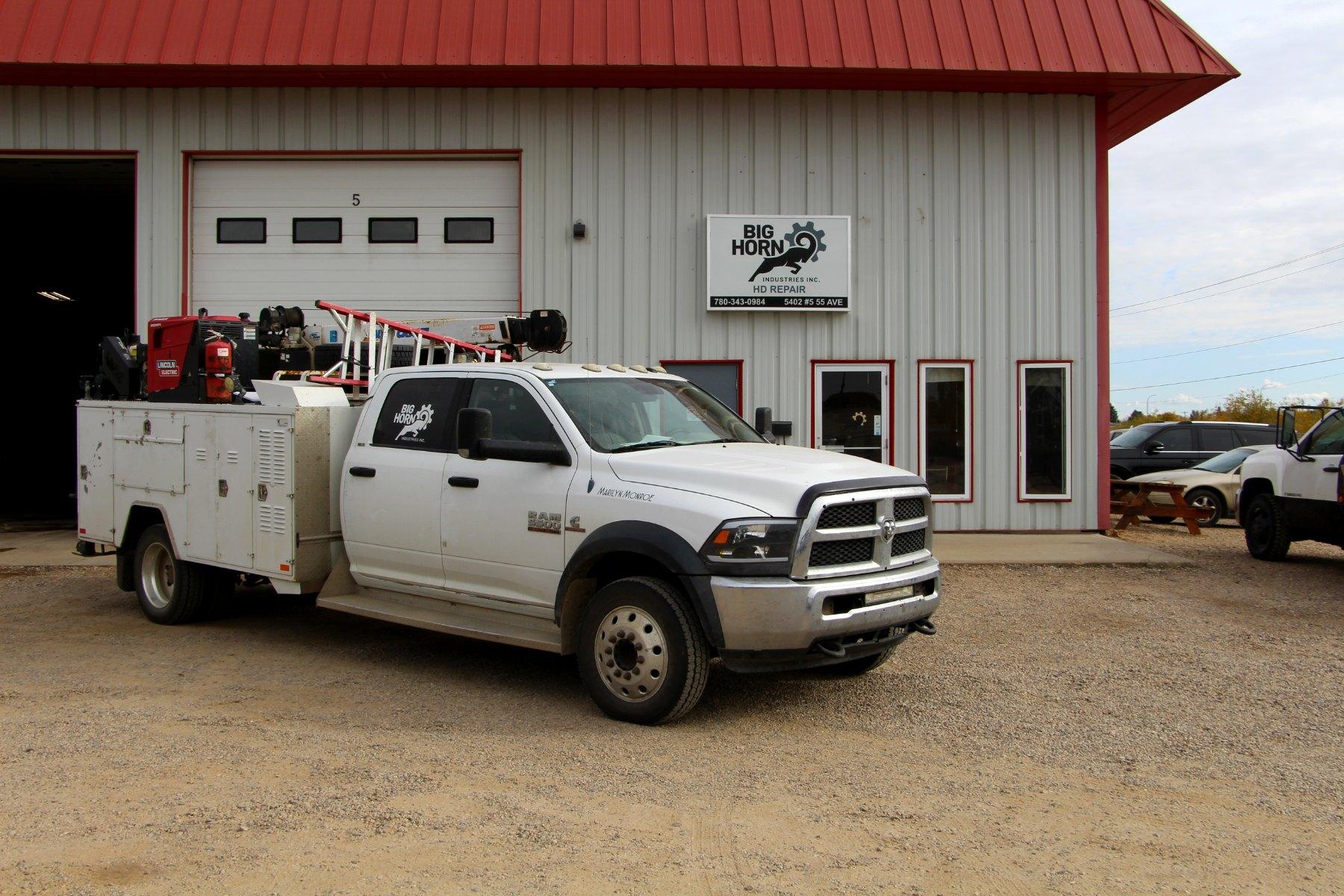 The Big Horn Ram 5500 mobile service truck parked in front of the shop on 55 Avenue.