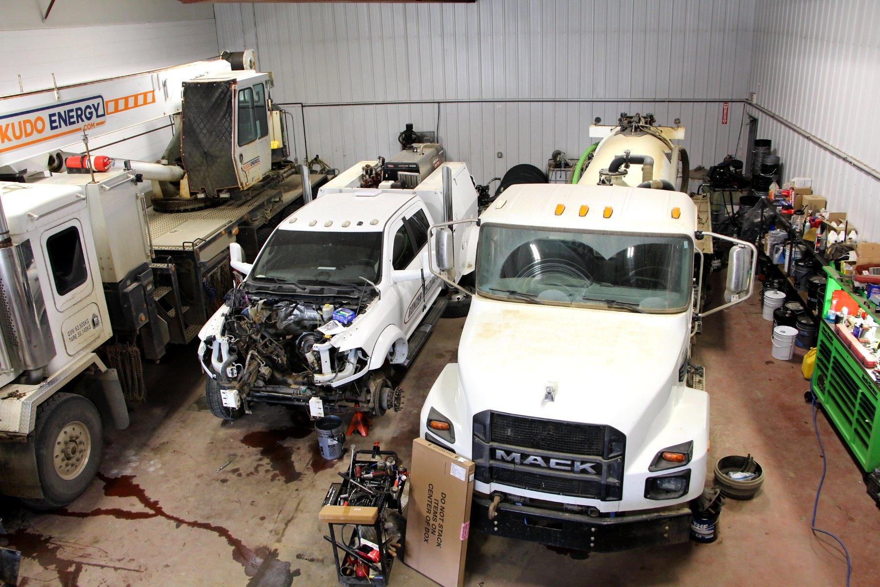 Overhead view of the Big Horn shop floor with trucks and heavy equipment in for repair.